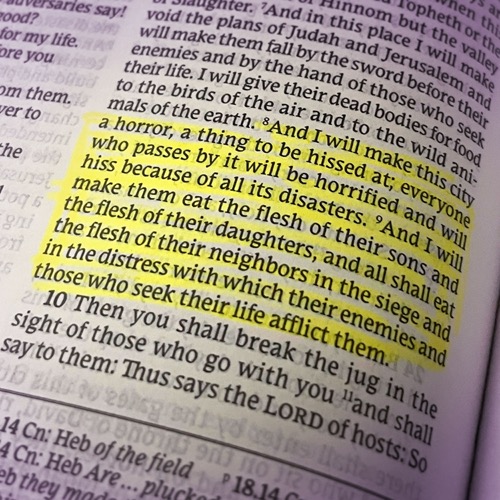 A Bible opened to a page about God driving people to cannibalism is highlighted.